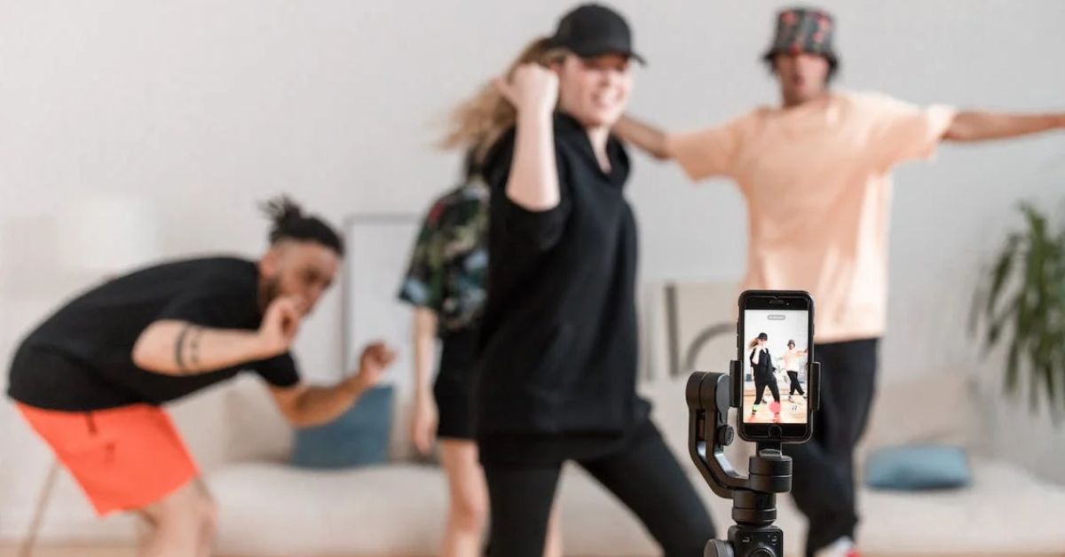 Free People Dancing in Front of a Smartphone 