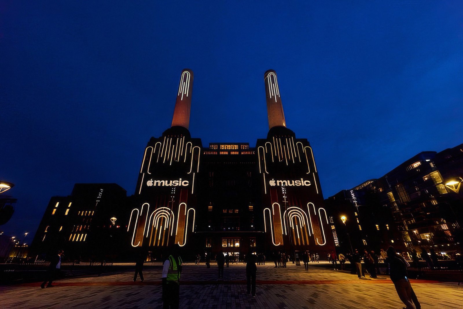 Apple Music Rebrand: The Logo Made by Sound 4 Battersea Power Station at night lit with Apple Music branding on its facade