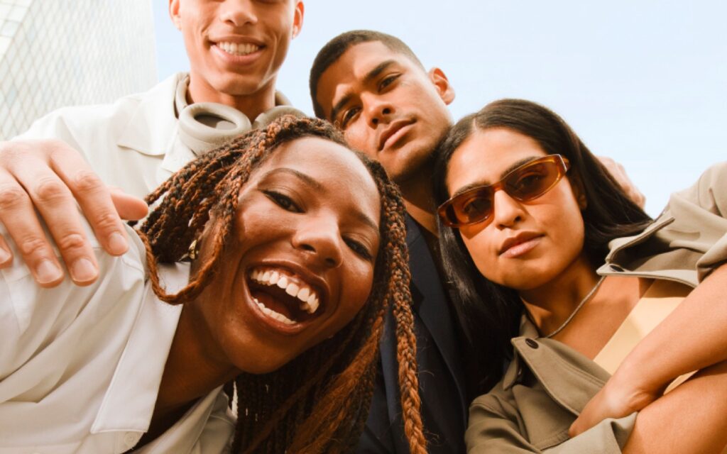 A group of friends smiling together outdoors